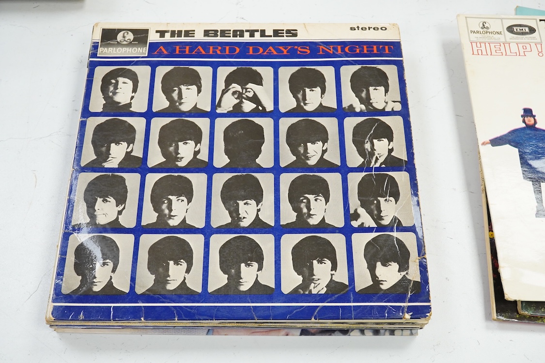 Fourteen LP record albums including eleven The Beatles and related; Sgt. Pepper’s Lonely Hearts Club Band (plus an additional three others), The Beatles at the Hollywood Bowl, Magical Mystery Tour, Revolver, etc., plus t